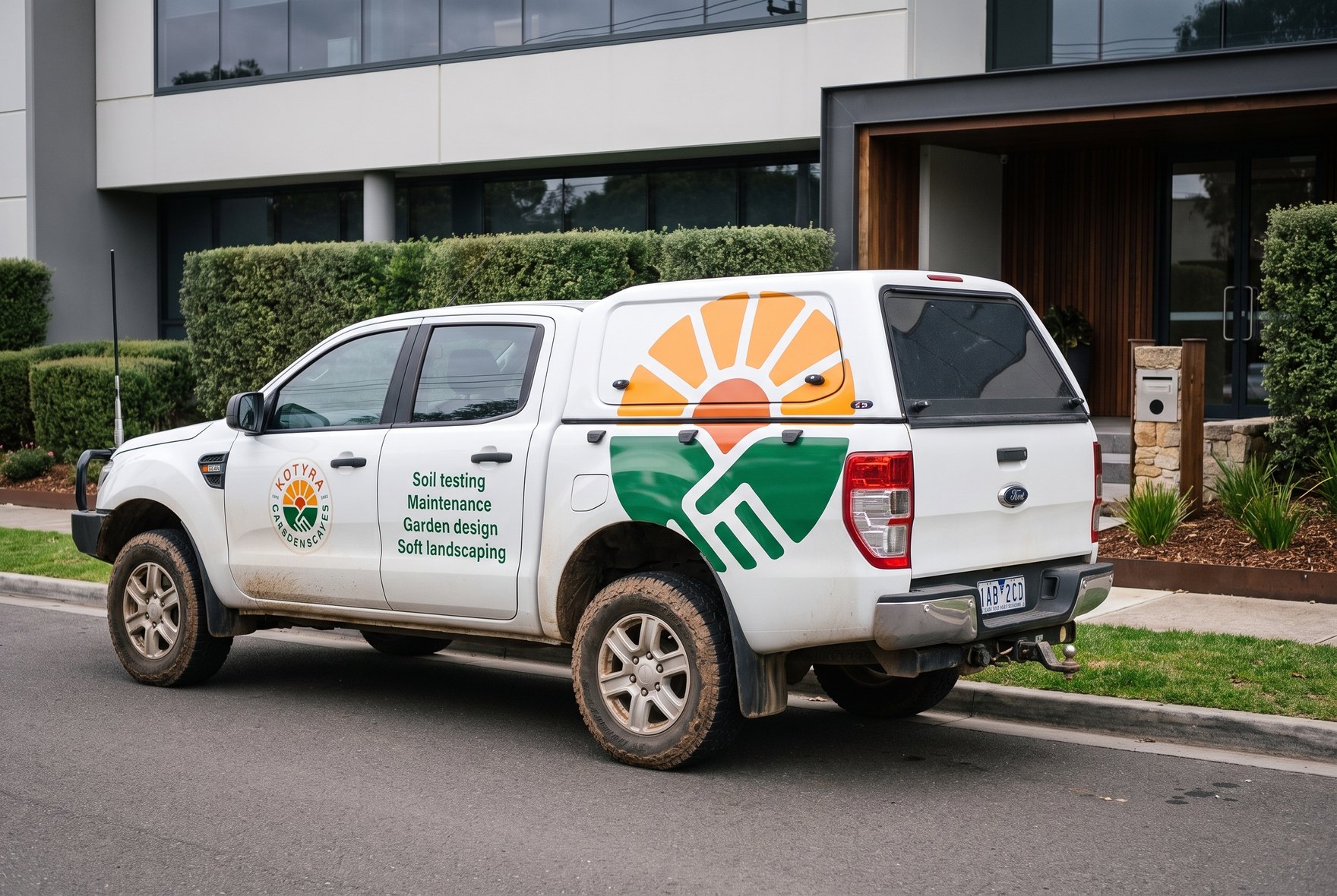 A white dual-cab ute wrapped with the Kotyra mark, the badge on the door and four services.